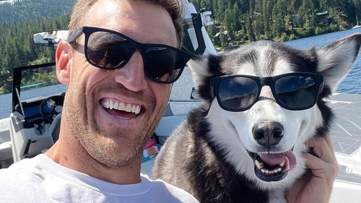 A dog and its owner pose wearing sunglasses, demonstrating heatwave safety.