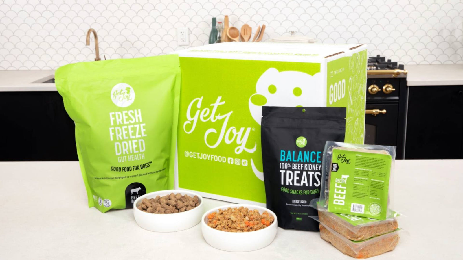 Get Joy's dog food and treats line are displayed, demonstrating the perfect dog food toppers for your dog.