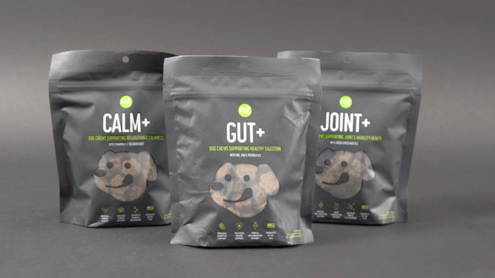 Three black bags of Get Joy's supplements - Joint+, Calm+, and Gut+ - are displayed against a gray background. This supplement line has earned the NASC quality seal.